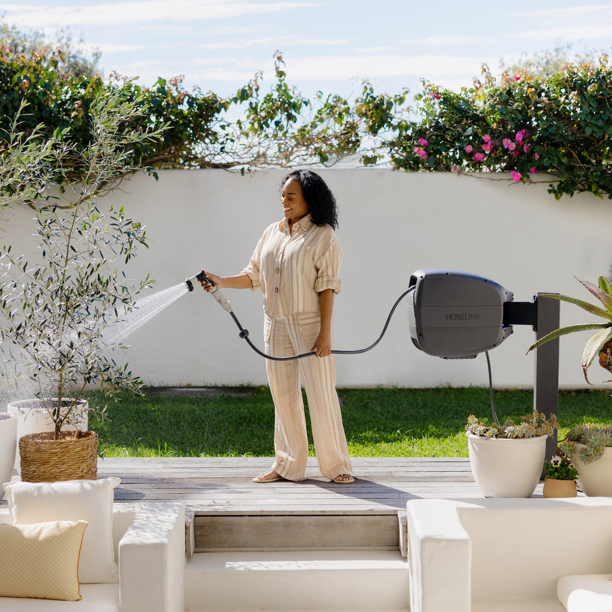 Evolve hose reel in use in a garden